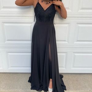 Long black open-back prom dress with side slit